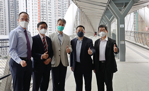 The Chief Structural Engineer (Development & Construction), Mr Rayson Wong (centre), and the winning team pictured at the Footbridge.